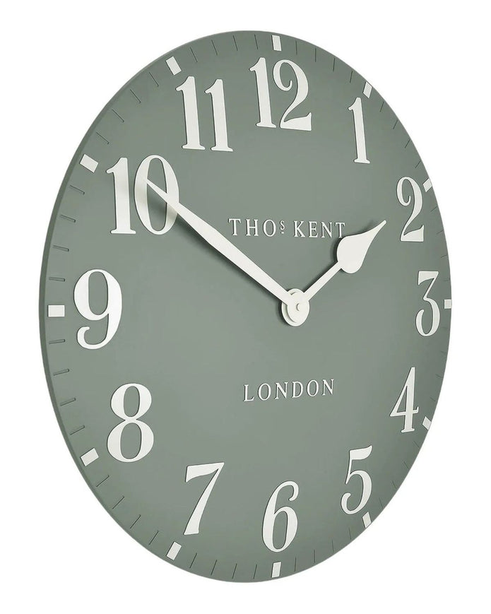 Thomas Kent 12-inch Arabic wall clock by Gallery Direct in Seagrass Green, featuring bold Arabic numerals and a modern design.