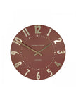 Thomas Kent 12-inch Mulberry wall clock by Gallery Direct, featuring a terracotta-colored round clock with black hands.