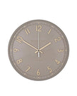 Thomas Kent 14-inch Tresco wall clock in taupe with a round face and minimalist design, mounted on a wall.