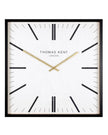 White Thomas Kent Garrick 16-inch wall clock with black Roman numerals and hands, mounted on a plain wall.
