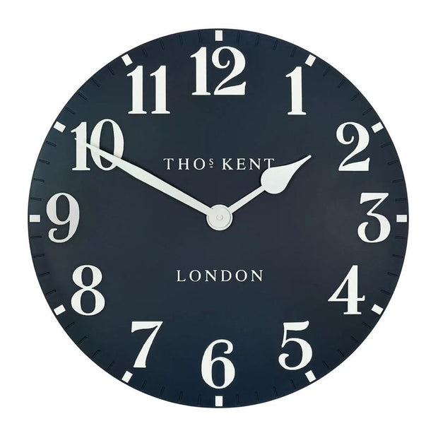 Thomas Kent 20-inch Arabic wall clock in ink blue with bold black numerals, stylishly displayed on a wall.