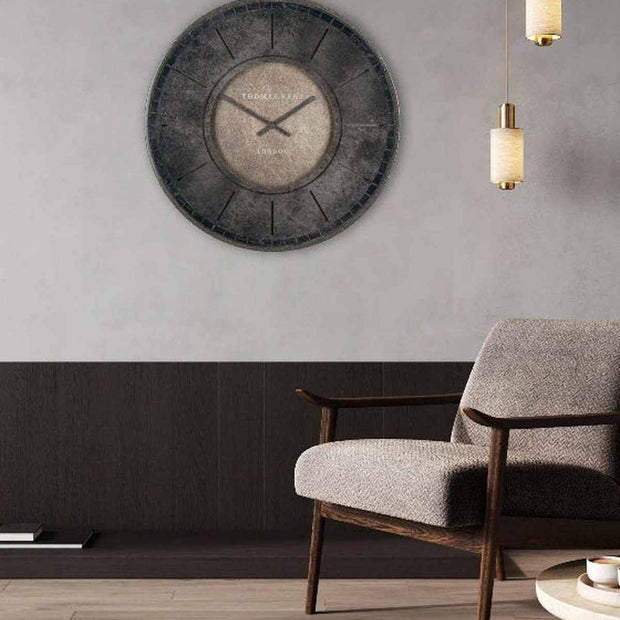 Thomas Kent Florentine Wall Clock in smoke color, modern 21-inch clock with sleek design, mounted on a wall.