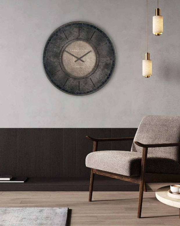 Thomas Kent Florentine Wall Clock in smoke color, modern 21-inch clock with sleek design, mounted on a wall.
