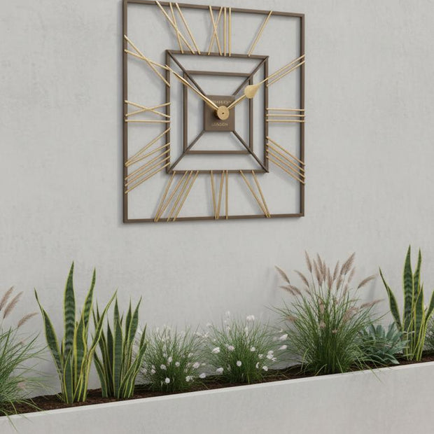 Thomas Kent 24-inch outdoor wall clock by Gallery Direct, square-shaped with a summer house design and classic clock face.