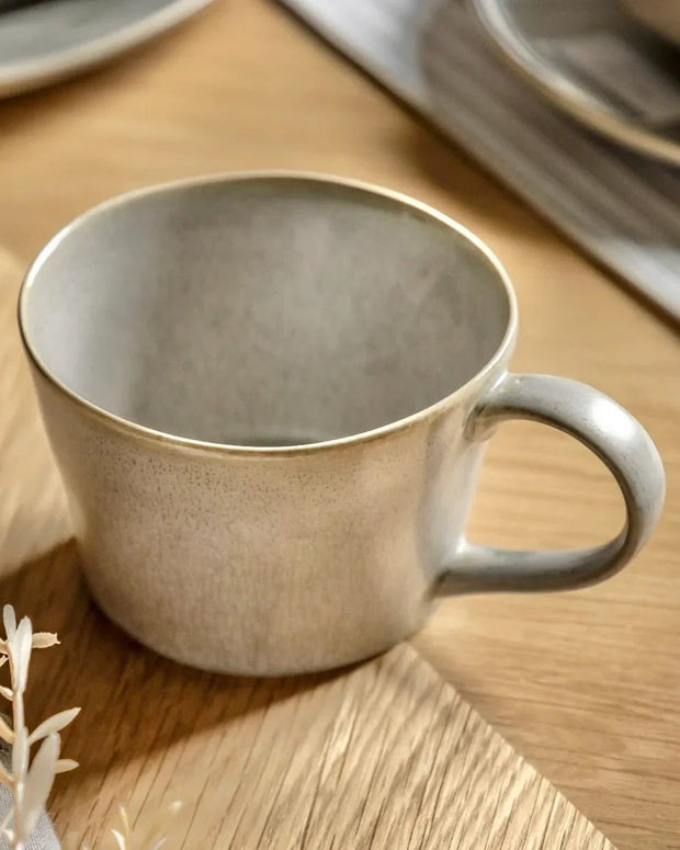 Beige Pebble Dash Reactive Glaze Organic Mug by Gallery Direct, shown on a kitchen countertop with a ceramic finish.