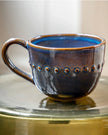 Blue organic beaded mug from Gallery Direct, showcasing a handcrafted ceramic design with beaded accents for kitchen and dining use.