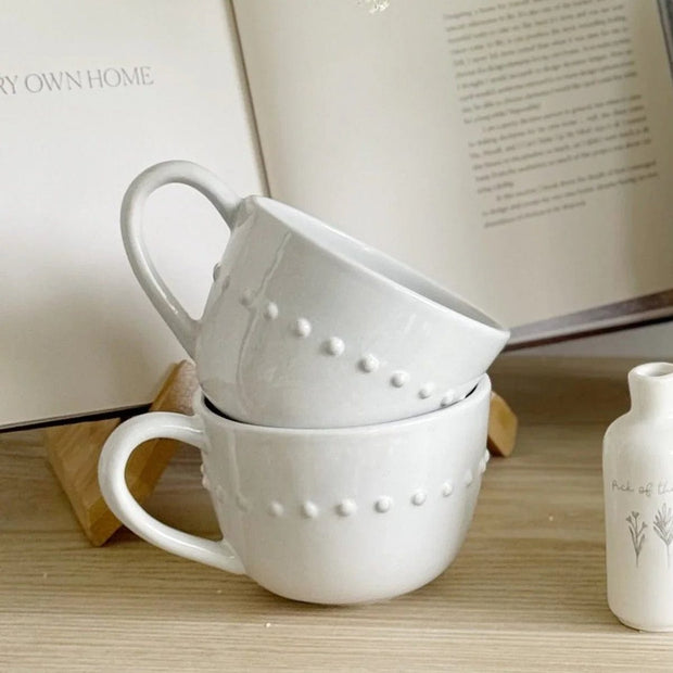 White organic beaded ceramic mug with textured beading, ideal for kitchen and dining, by Gallery Direct.