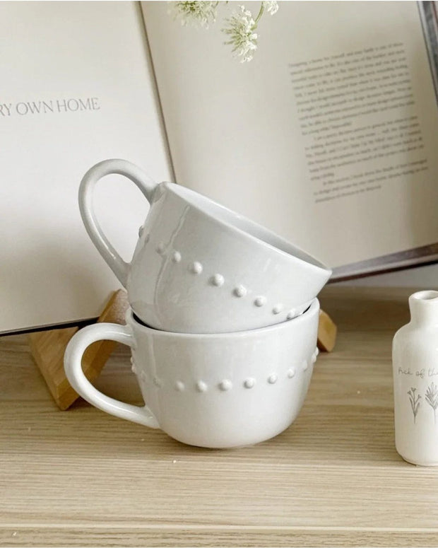 White organic beaded ceramic mug with textured beading, ideal for kitchen and dining, by Gallery Direct.