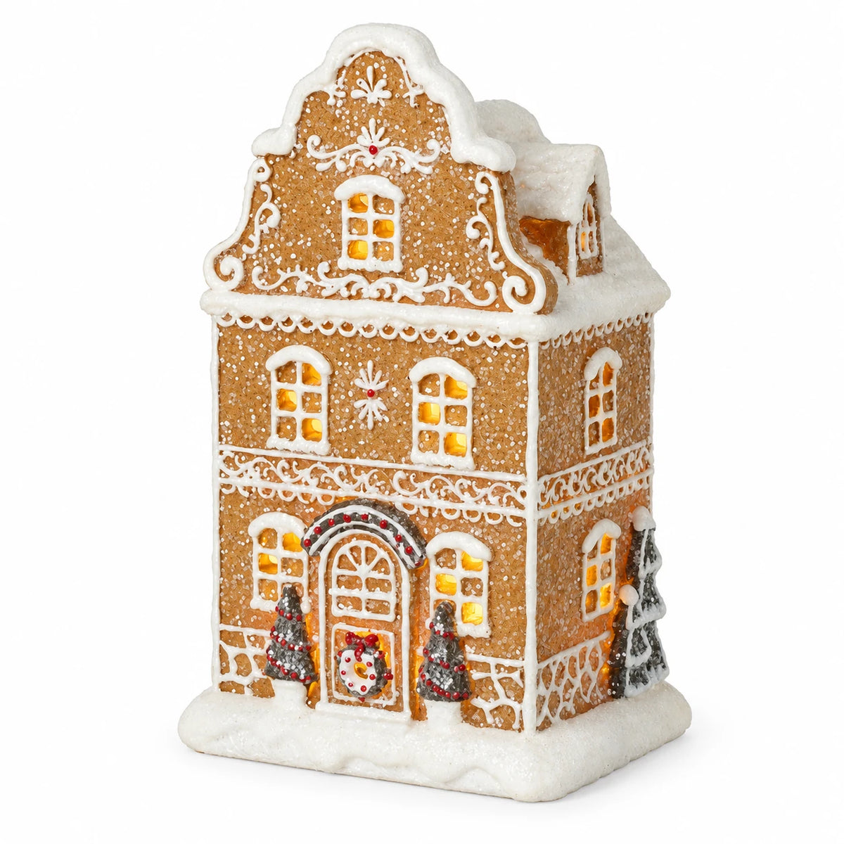 Detailed studio view of gingerbread house icing, snowy roof and miniature trees