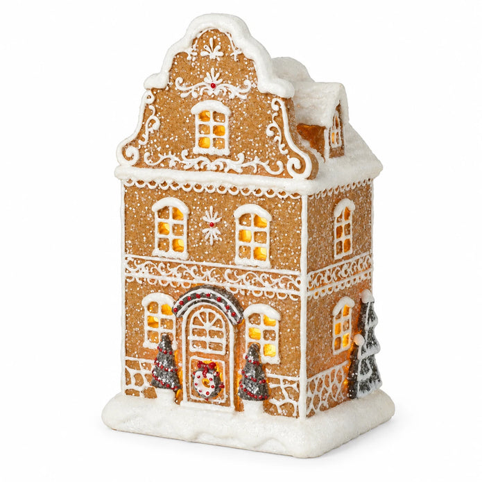 Detailed studio view of gingerbread house icing, snowy roof and miniature trees