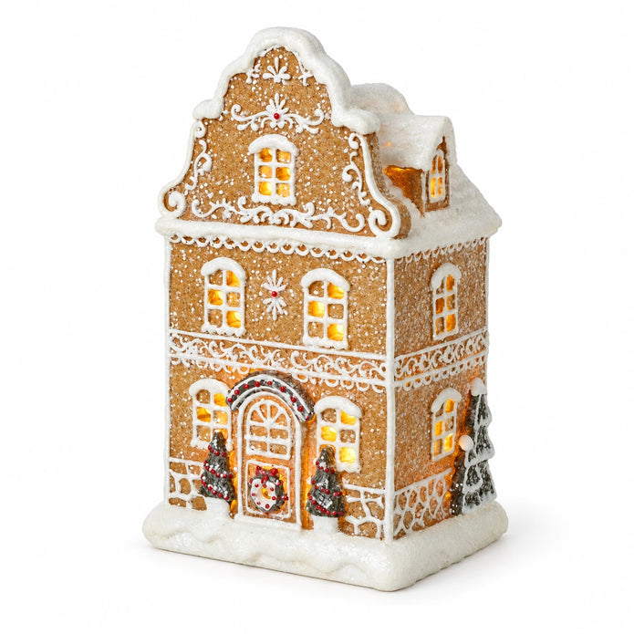 Gingerbread house with trees on white background, showing front and right side