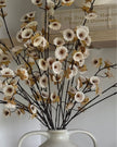 Artificial neutral spring flower stem by Gisela Graham, realistic faux plant with delicate blossoms and green foliage.
