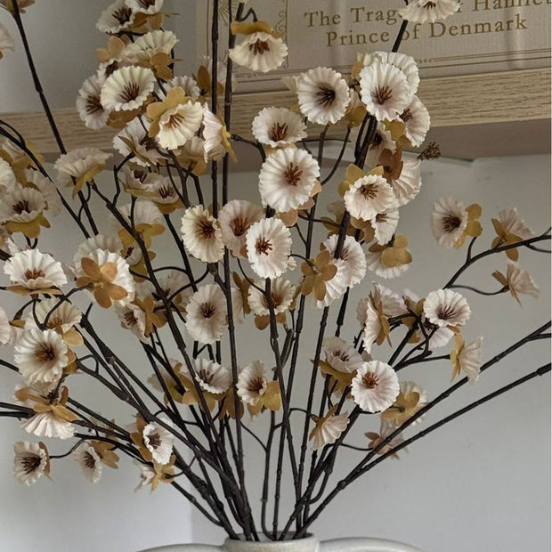 Artificial neutral spring flower stem by Gisela Graham, realistic faux plant with delicate blossoms and green foliage.