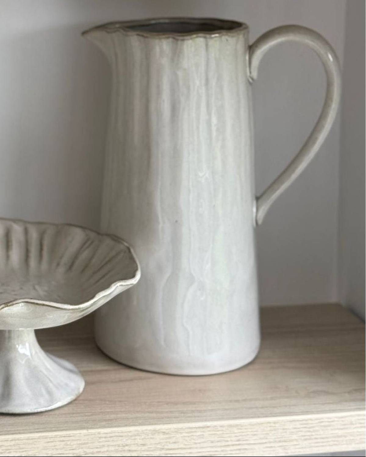 Beige stoneware pinched jug from Gisela Graham for kitchen and dining, featuring a handcrafted, textured design.