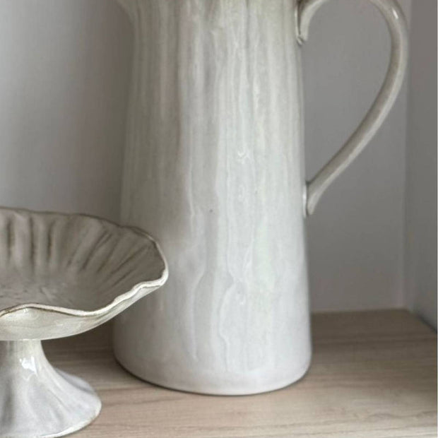Beige stoneware pinched jug from Gisela Graham for kitchen and dining, featuring a handcrafted, textured design.