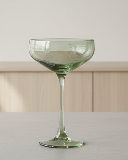 Green leaf garland coupe cocktail glass from Gisela Graham, with decorative leaf details, ideal for stylish kitchen and dining use.