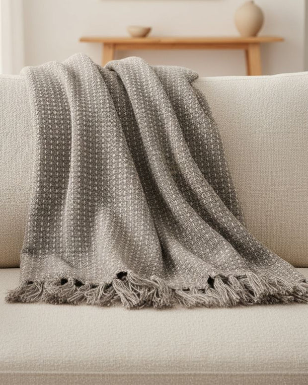 Beige cotton throw blanket with stab stitch detail from Gisela Graham, soft furnishings for cozy, stylish home decor.