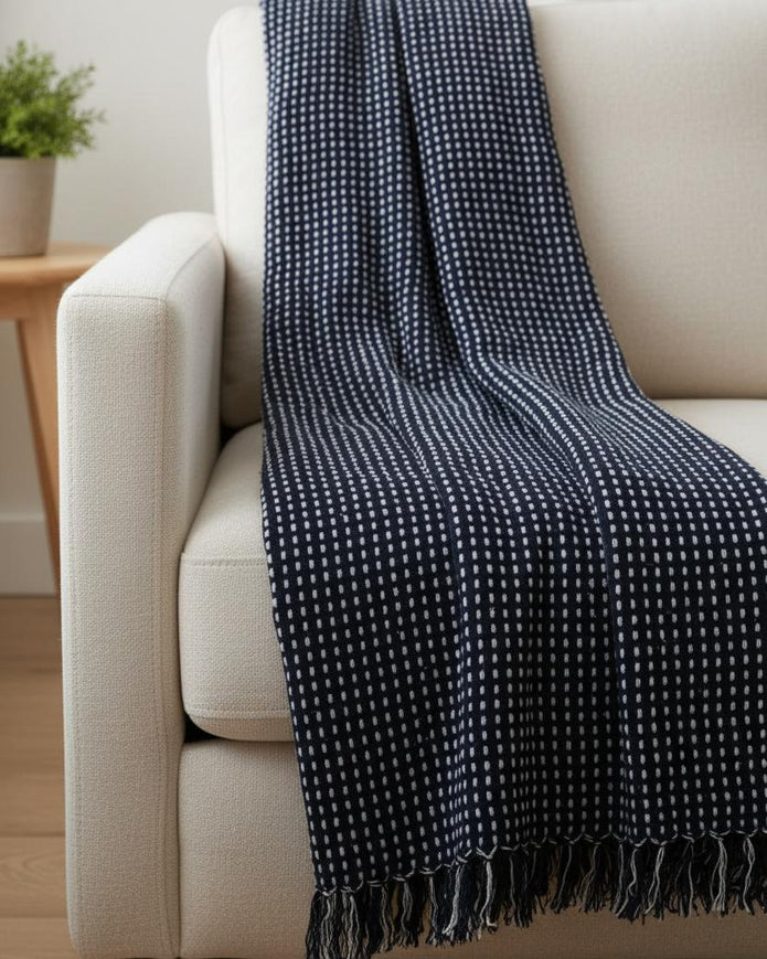 Navy blue cotton throw blanket with stab stitch design from Gisela Graham, soft furnishings for cozy living spaces.