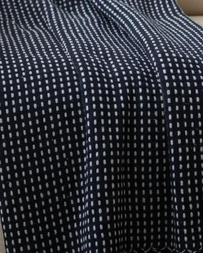 Navy blue cotton throw blanket with stab stitch detailing from Gisela Graham, soft furnishings for cozy decor.