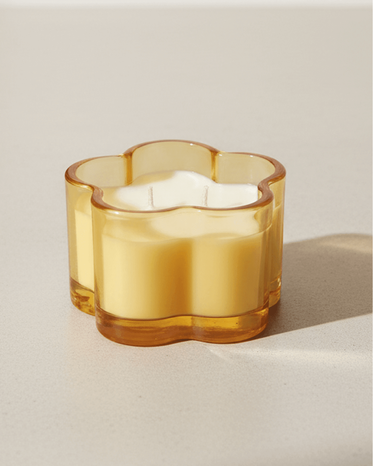 Orange glass flower scented candle by Gisela Graham, spring-themed candle with floral design and warm orange color.