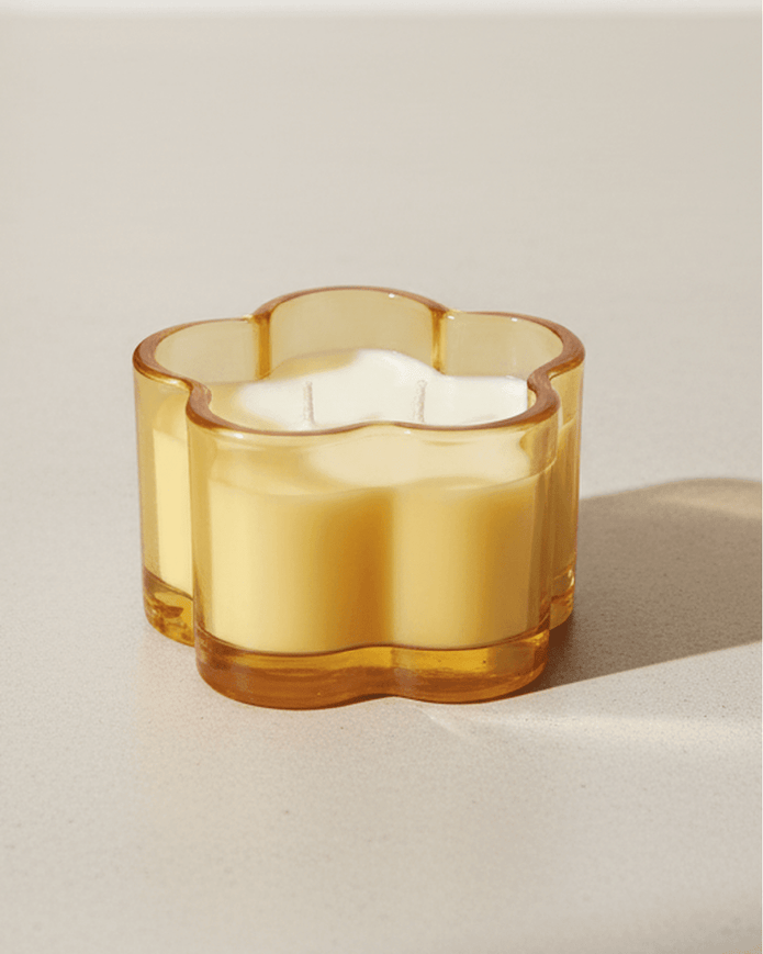 Orange glass flower scented candle by Gisela Graham, spring-themed candle with floral design and warm orange color.