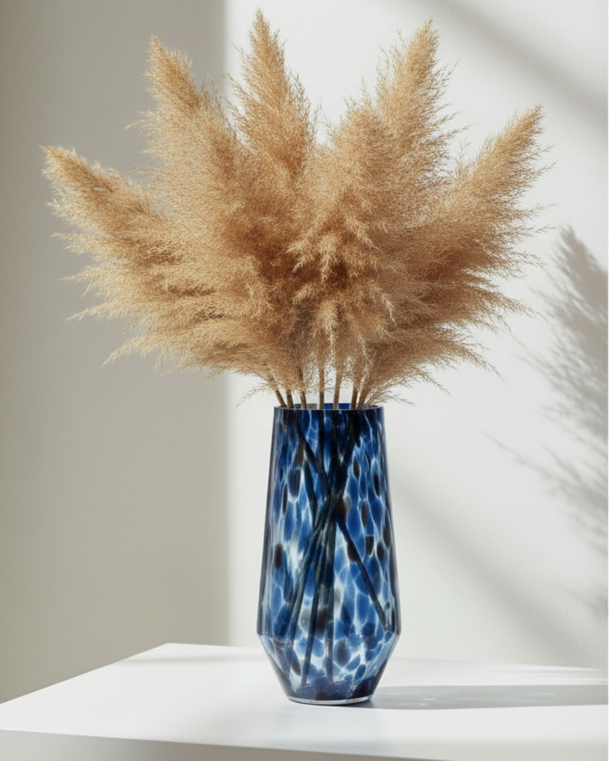 Blue and brown tortoiseshell tall glass vase by Gisela Graham, featuring a sleek design with a vibrant tortoiseshell pattern.