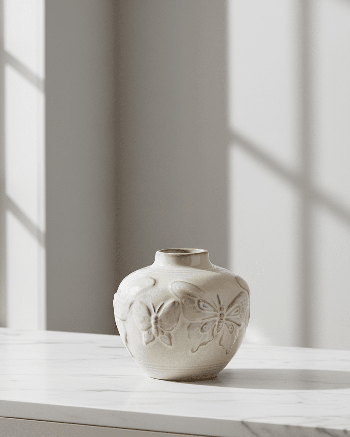 Small taupe porcelain butterfly bud vase by Gisela Graham, featuring delicate butterfly design and smooth ceramic finish.