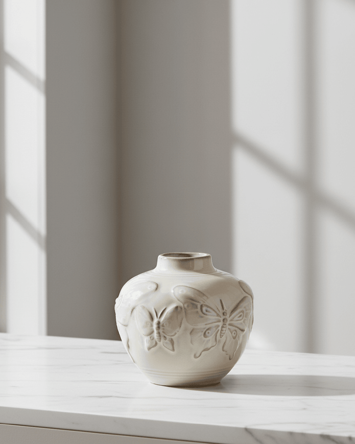 Small taupe porcelain butterfly bud vase by Gisela Graham, featuring delicate butterfly design and smooth ceramic finish.