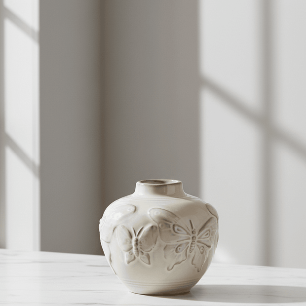 Small taupe porcelain butterfly bud vase by Gisela Graham, featuring delicate butterfly design and smooth ceramic finish.