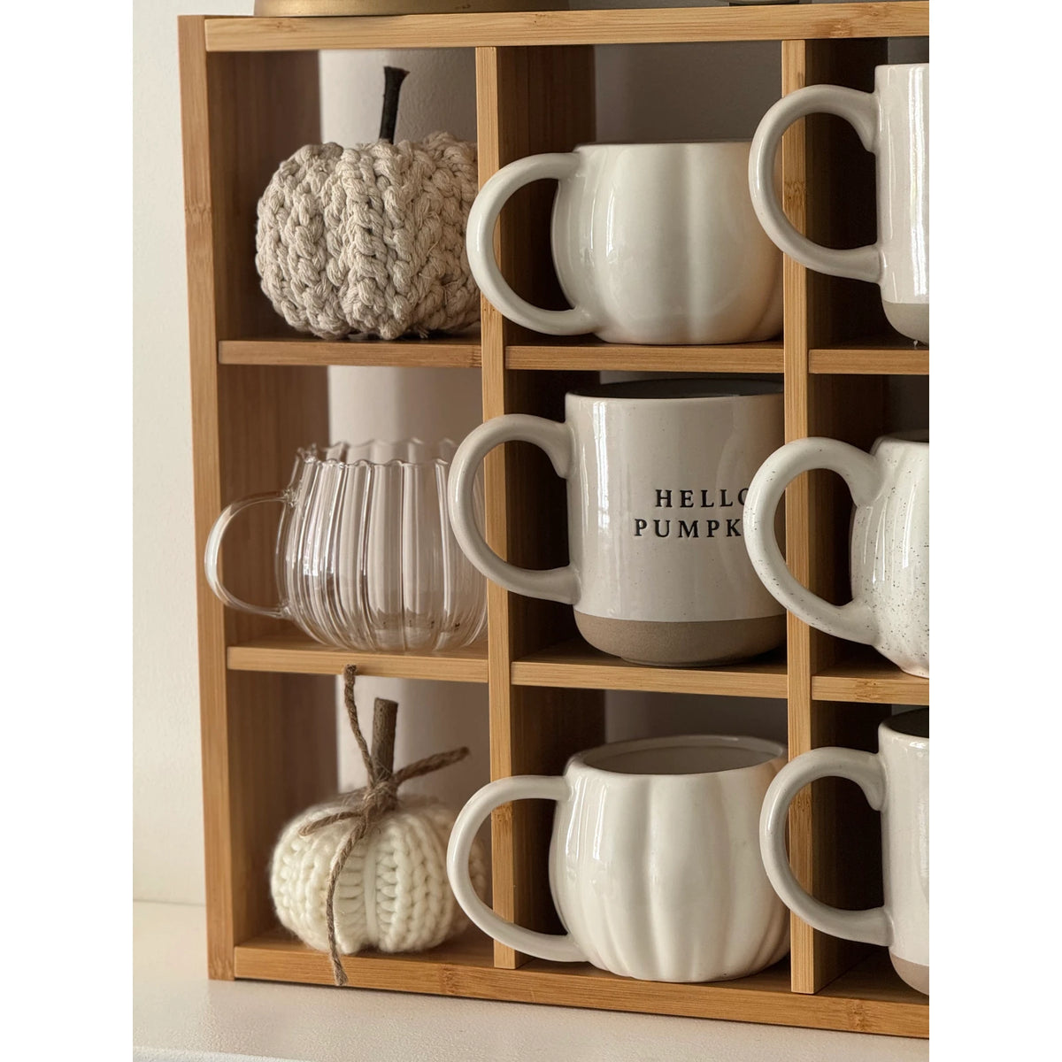 Glass Pumpkin Mug, clear pumpkin mugs displayed with ceramic mugs on shelves