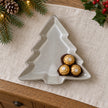 Glazed ceramic tree dish lying flat, with wrapped chocolates