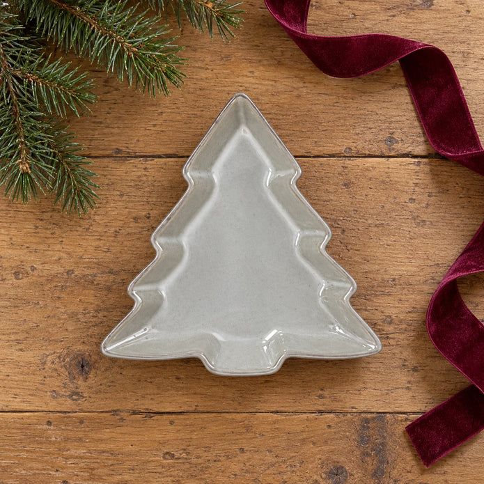 Glazed ceramic tree dish lying flat, overhead on a Christmas oak table