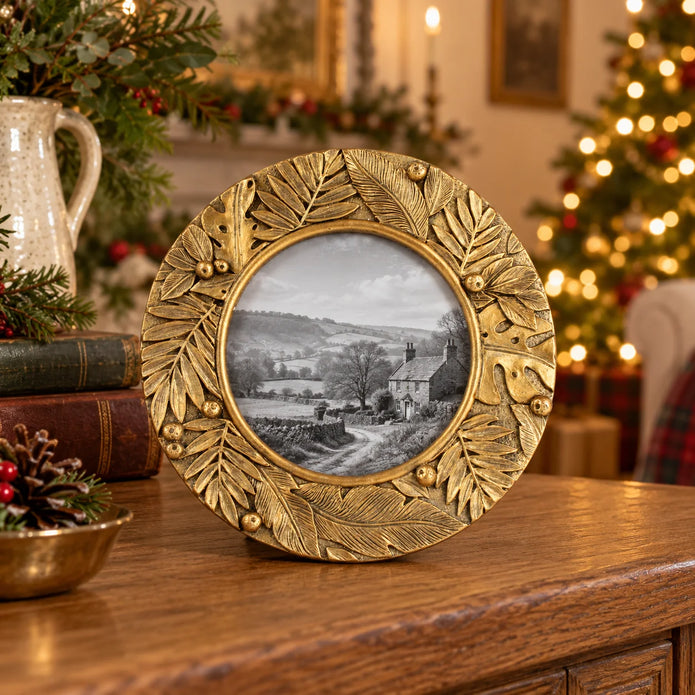 Gold botanical round photo frame by Originals International Ltd with decorative leaf detailing