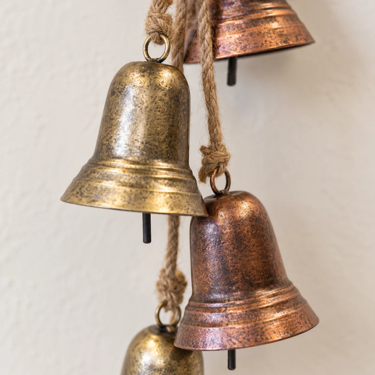 Close-up of aged gold and copper bell rims, patina and clappers