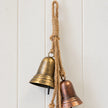 Close-up of the natural jute hanging loop, knots and upper gold bell
