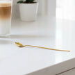 Gold flower long latte spoon by Starlight Express with a detailed floral design and elegant long handle.