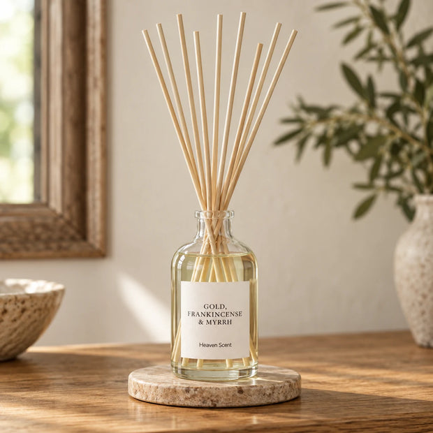 Gold, Frankincense And Myrrh Reed Diffuser styled on an oak console with natural reeds inserted.