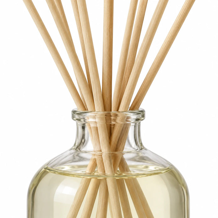 Gold, Frankincense And Myrrh Reed Diffuser close-up of natural rattan reeds and the glass bottle neck.