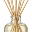 Gold, Frankincense And Myrrh Reed Diffuser close-up of natural rattan reeds and the glass bottle neck.