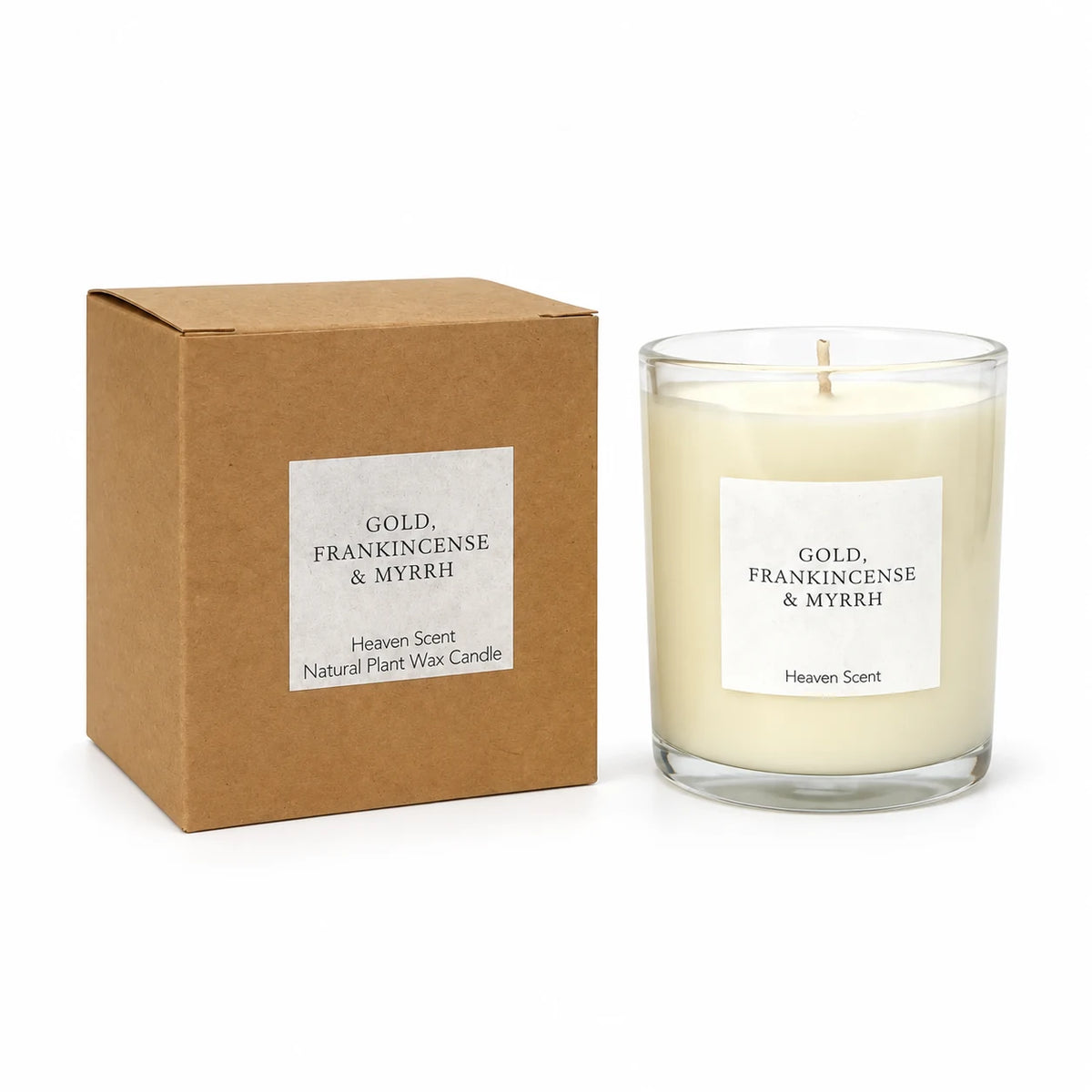 Heaven Scent Gold, Frankincense & Myrrh Medium Candle, unlit with its brown kraft box against white