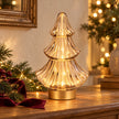 Gold LED Christmas tree lamp by Candlelight Products Ltd, illuminated with glowing lights, perfect for festive holiday decor.