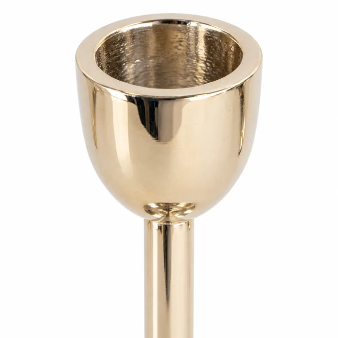 large gold metal candlestick holder close-up of empty rounded candle socket