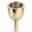 large gold metal candlestick holder close-up of empty rounded candle socket