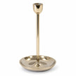large gold metal candlestick holder empty on a white studio background