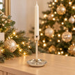 Small gold metal candlestick holder by Satchville, featuring a sleek design suitable for elegant home decor or tabletop display.