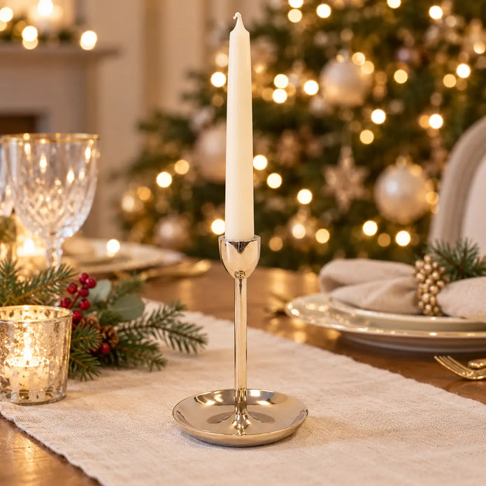 Small gold metal candlestick holder by Satchville, featuring a sleek, modern design for tabletop decoration or candle display.