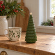 Green Satchville ceramic Christmas tree, 20cm tall, displayed on a kitchen scale
