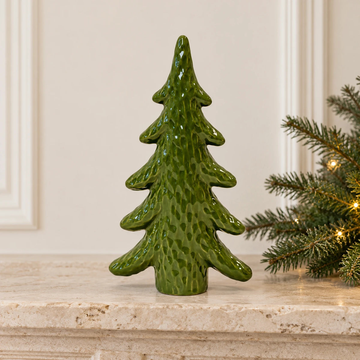 Green ceramic Christmas tree ornament, medium Satchville holiday decor displayed on a mantel