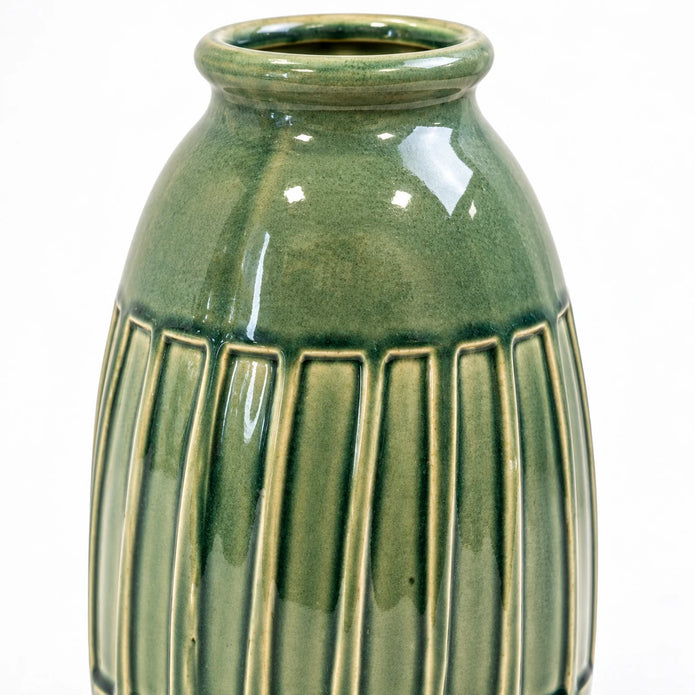 Medium green ceramic vase white-background studio close-up of the real ribbed relief and shoulder glaze.