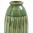 Medium green ceramic vase white-background studio close-up of the real ribbed relief and shoulder glaze.